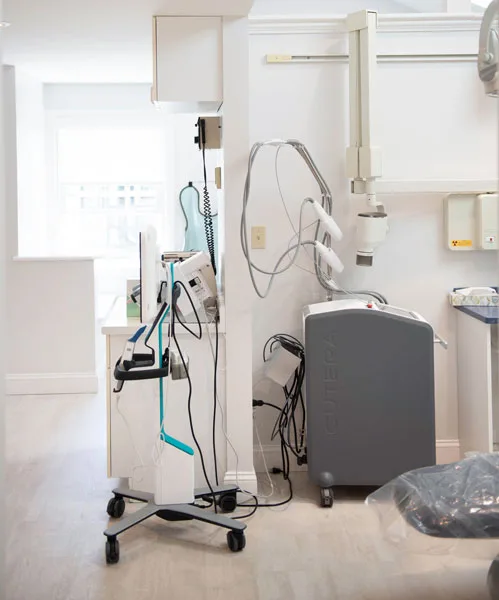 Intraoral scanning and imaging equipment beside a treatment chair
