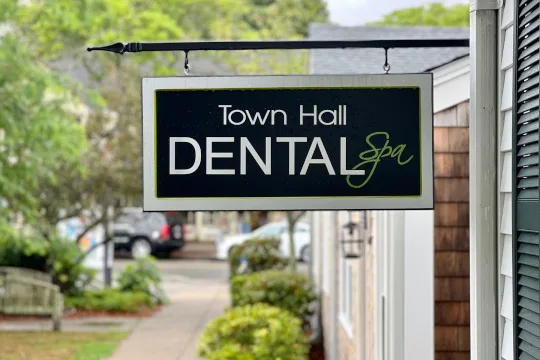 The Town Hall Dental Spa sign hanging outside the office on Town Hall Square